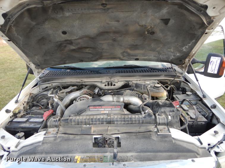 image for item DC0424 2004 Ford F350 Super Duy Lariat Crew Cab flatbed pickup truck