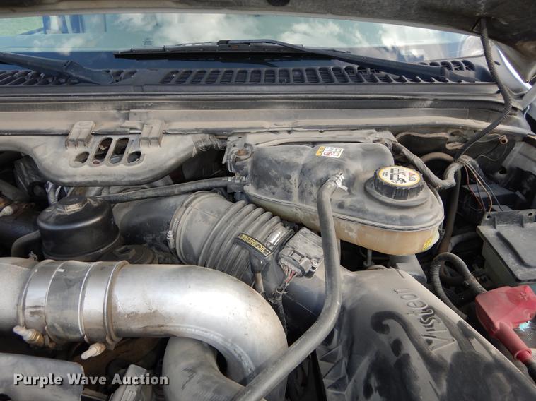 image for item DC0424 2004 Ford F350 Super Duy Lariat Crew Cab flatbed pickup truck