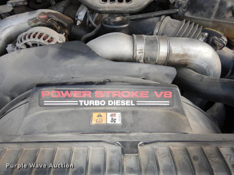 image for item DC0424 2004 Ford F350 Super Duy Lariat Crew Cab flatbed pickup truck