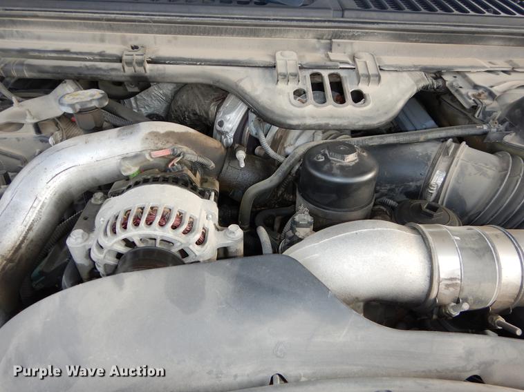 image for item DC0424 2004 Ford F350 Super Duy Lariat Crew Cab flatbed pickup truck