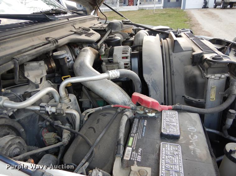 image for item DC0424 2004 Ford F350 Super Duy Lariat Crew Cab flatbed pickup truck