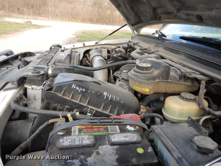 image for item DC0424 2004 Ford F350 Super Duy Lariat Crew Cab flatbed pickup truck