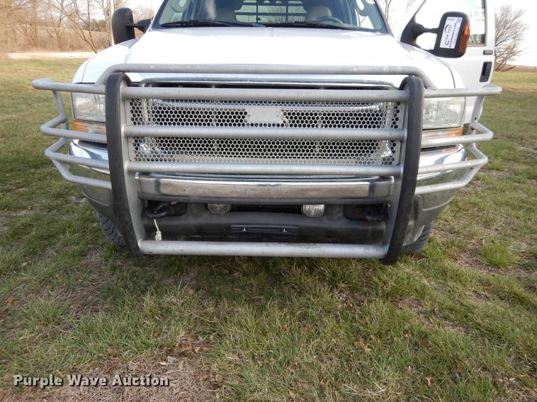 image for item DC0424 2004 Ford F350 Super Duy Lariat Crew Cab flatbed pickup truck