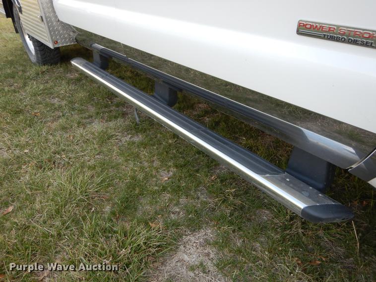 image for item DC0424 2004 Ford F350 Super Duy Lariat Crew Cab flatbed pickup truck