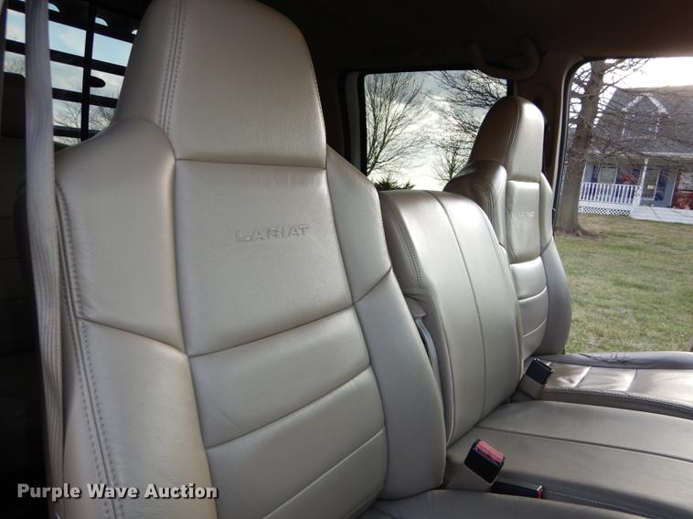 image for item DC0424 2004 Ford F350 Super Duy Lariat Crew Cab flatbed pickup truck