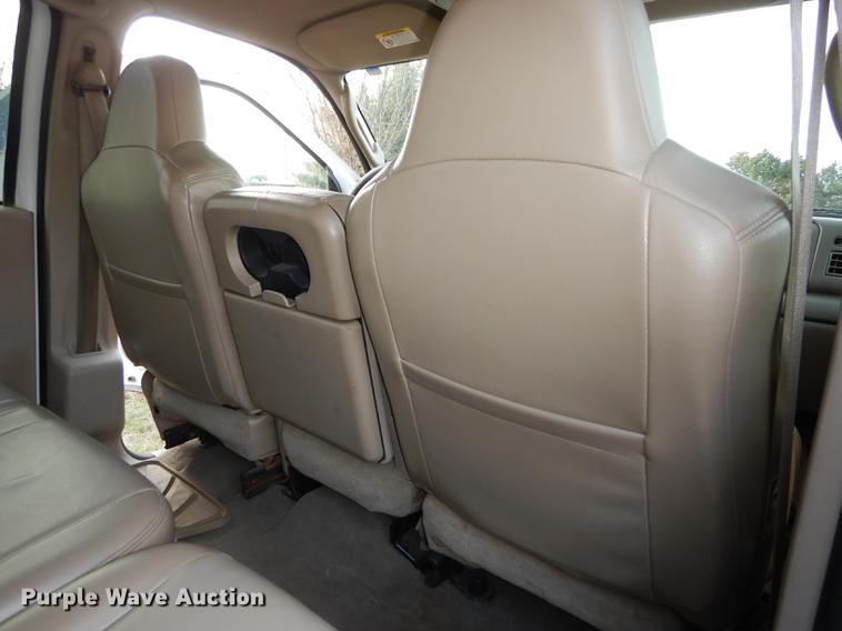 image for item DC0424 2004 Ford F350 Super Duy Lariat Crew Cab flatbed pickup truck