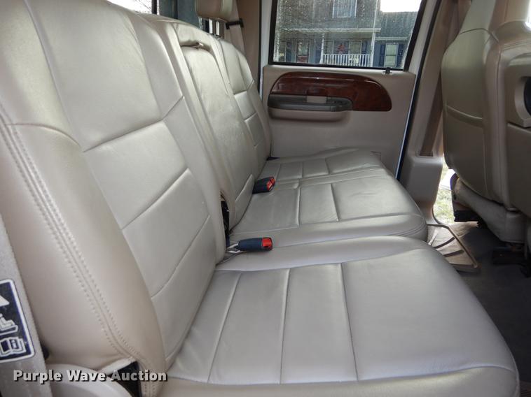 image for item DC0424 2004 Ford F350 Super Duy Lariat Crew Cab flatbed pickup truck