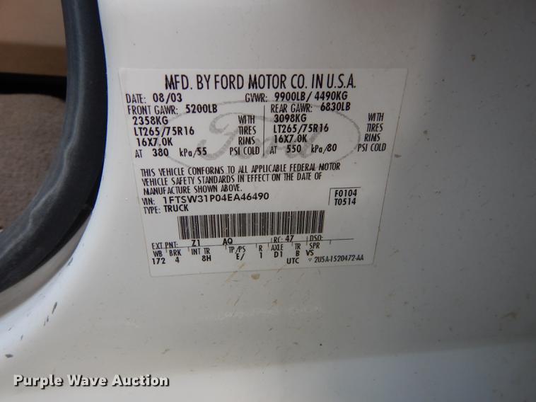 image for item DC0424 2004 Ford F350 Super Duy Lariat Crew Cab flatbed pickup truck