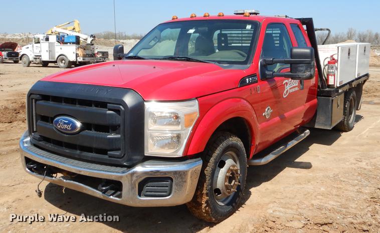 image for item EJ9905 2011 Ford F350 Super Duty SuperCab flatbed pickup truck
