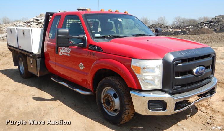 image for item EJ9905 2011 Ford F350 Super Duty SuperCab flatbed pickup truck