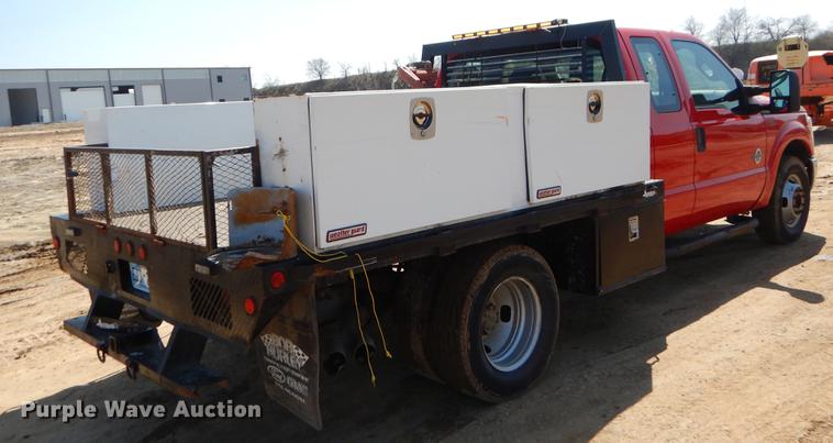 image for item EJ9910 2011 Ford F350 Super Duty SuperCab flatbed pickup truck