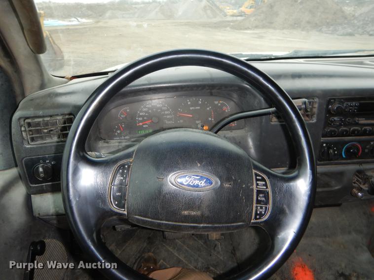 image for item EJ9915 2004 Ford F350 Super Duty SuperCab flatbed pickup truck