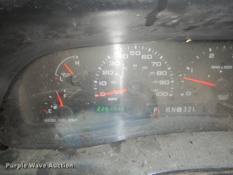 image for item EJ9915 2004 Ford F350 Super Duty SuperCab flatbed pickup truck