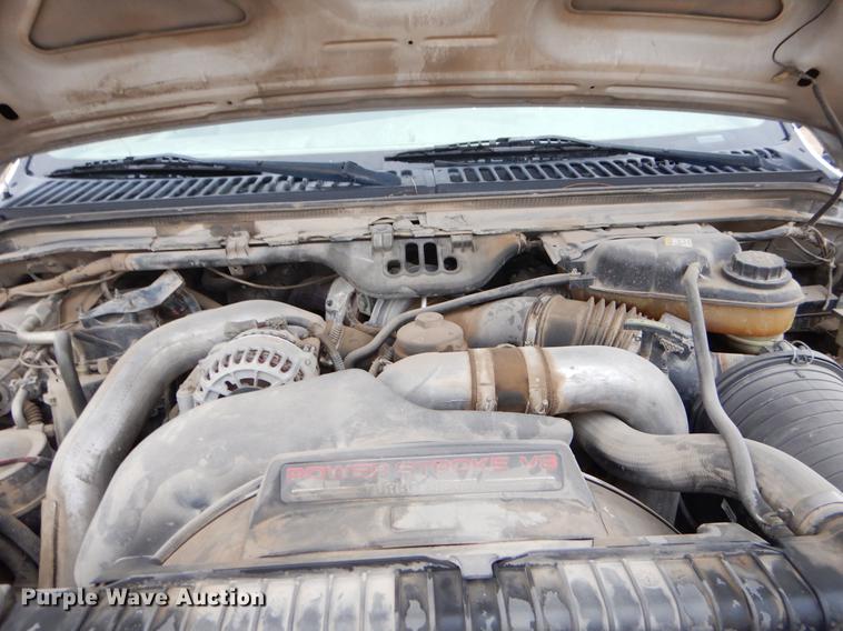 image for item EJ9915 2004 Ford F350 Super Duty SuperCab flatbed pickup truck