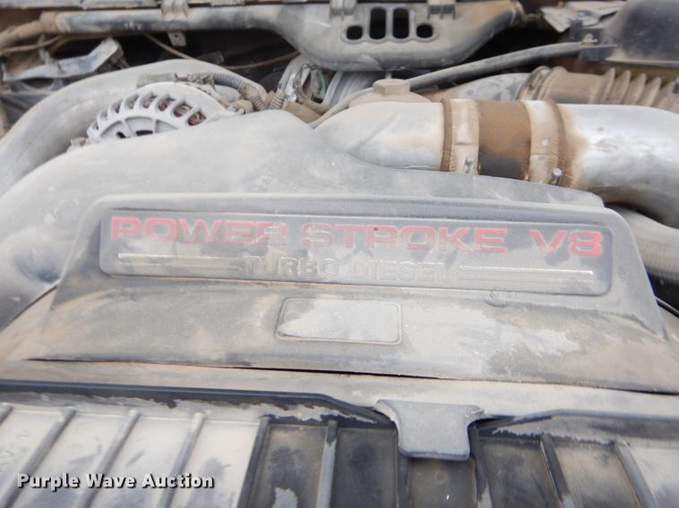 image for item EJ9915 2004 Ford F350 Super Duty SuperCab flatbed pickup truck