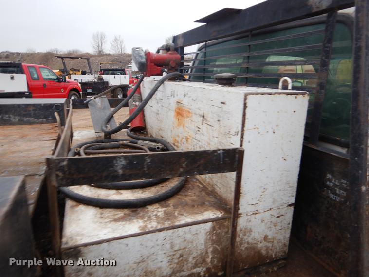 image for item EJ9915 2004 Ford F350 Super Duty SuperCab flatbed pickup truck