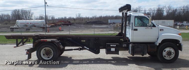 image for item DC7367 1999 GMC C7500 roll-off container truck