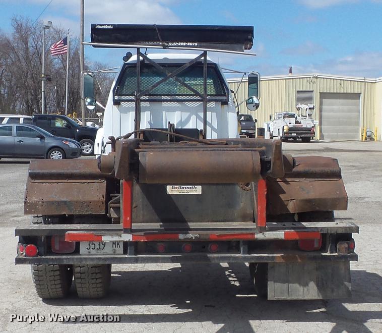 image for item DC7367 1999 GMC C7500 roll-off container truck