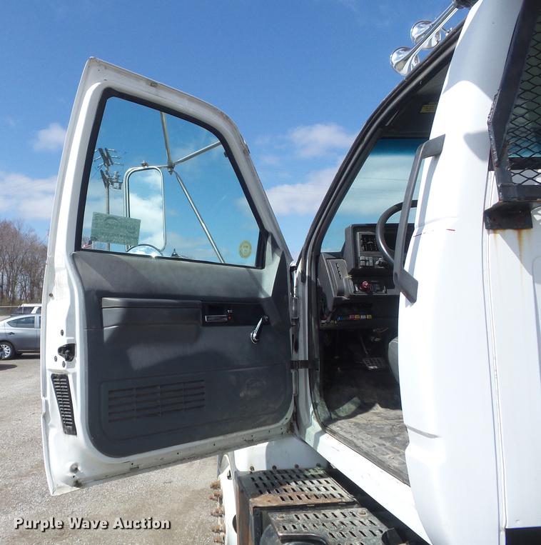 image for item DC7367 1999 GMC C7500 roll-off container truck