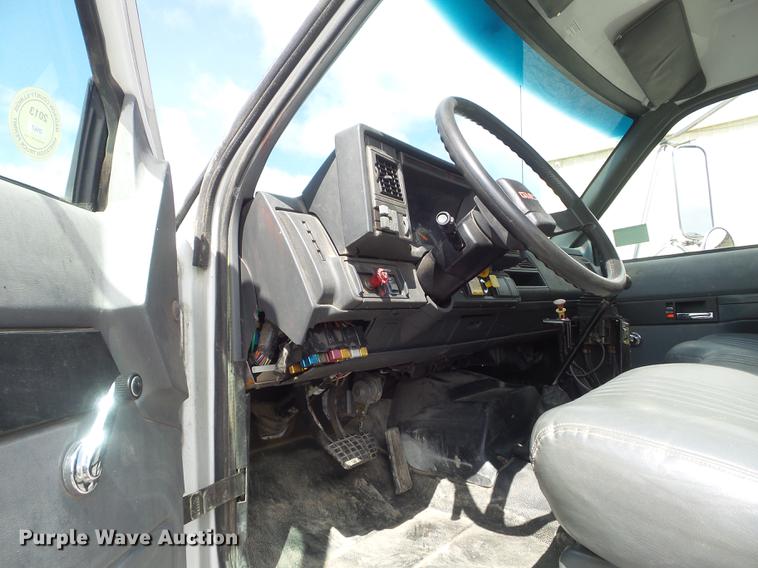 image for item DC7367 1999 GMC C7500 roll-off container truck