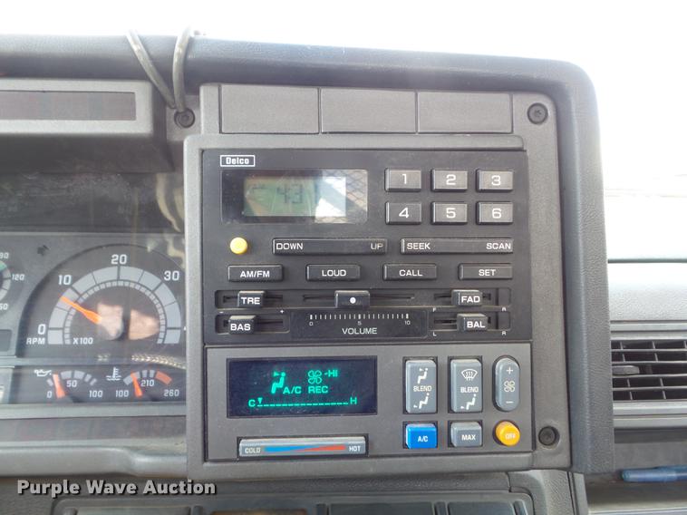 image for item DC7367 1999 GMC C7500 roll-off container truck