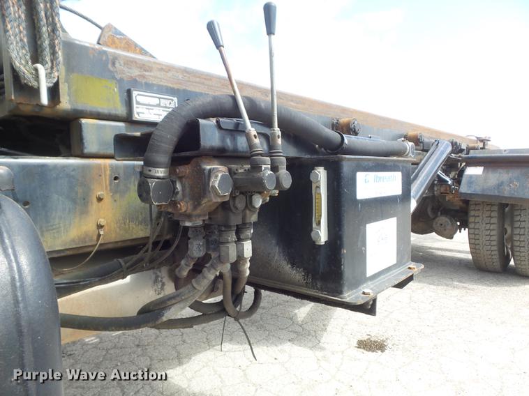 image for item DC7367 1999 GMC C7500 roll-off container truck