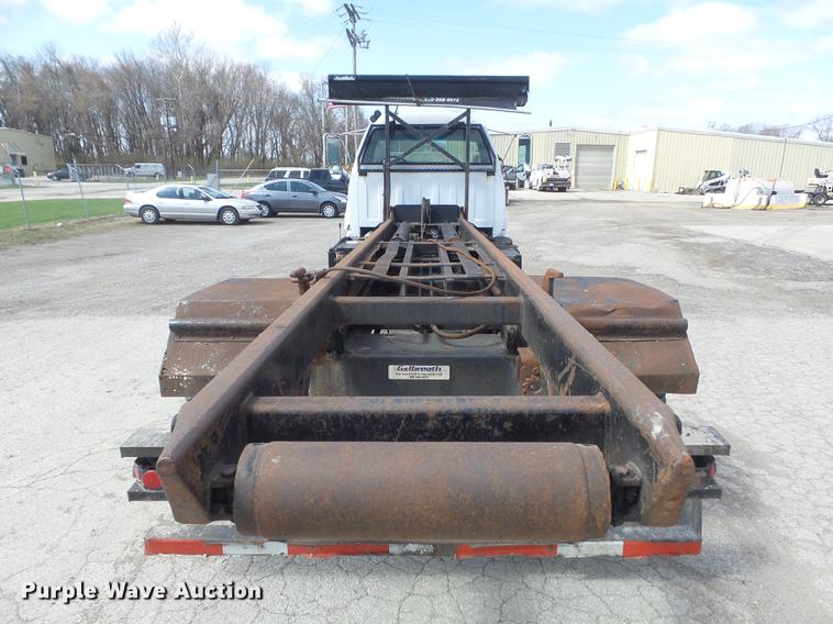 image for item DC7367 1999 GMC C7500 roll-off container truck