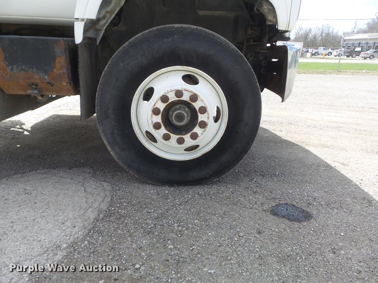 image for item DC7367 1999 GMC C7500 roll-off container truck