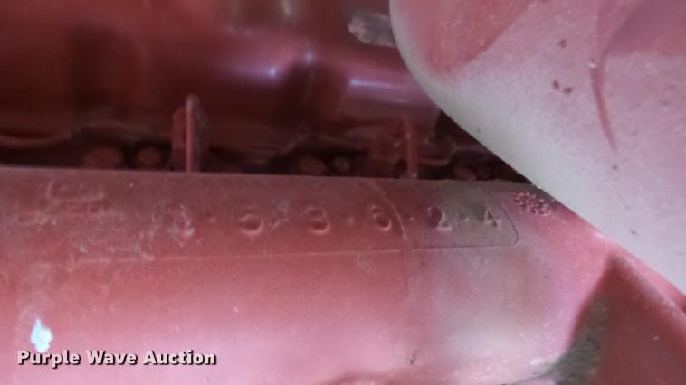 image for item DC3112 New Holland 1079 bale stacker