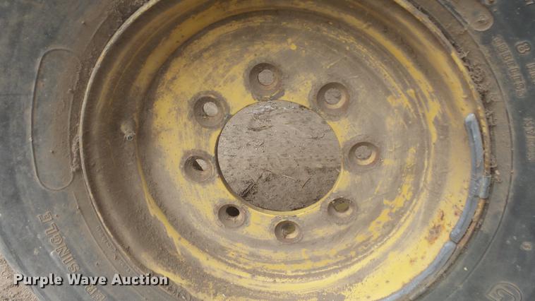 image for item DC3112 New Holland 1079 bale stacker