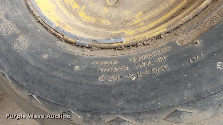 image for item DC3112 New Holland 1079 bale stacker