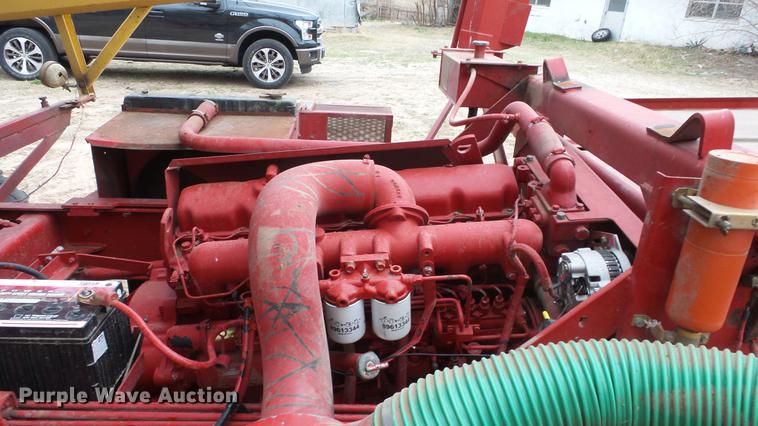 image for item DC3112 New Holland 1079 bale stacker