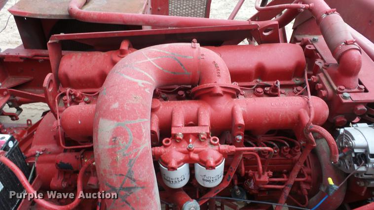 image for item DC3112 New Holland 1079 bale stacker