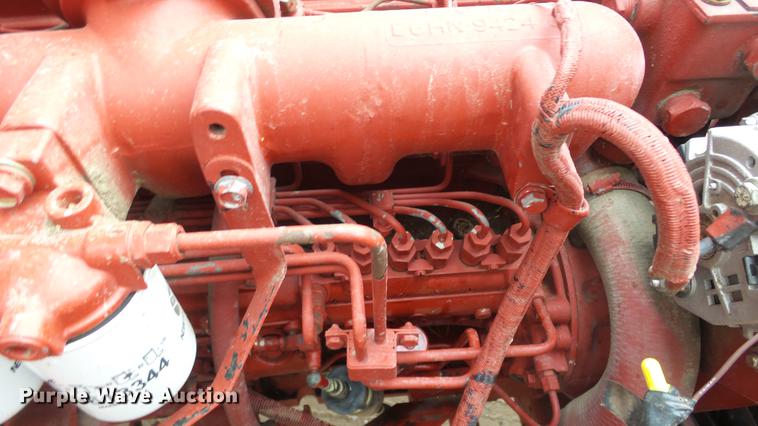 image for item DC3112 New Holland 1079 bale stacker