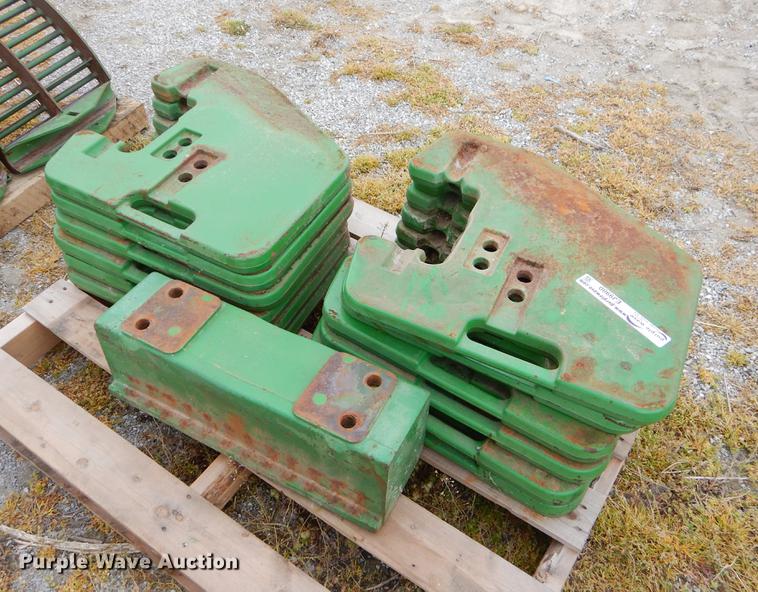 image for item EJ9980 Approximately 12 John Deere counter weights