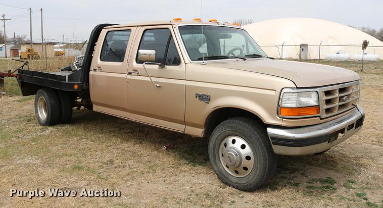 image for item DC7621 1997 Ford F350 Crew Cab flatbed pickup truck