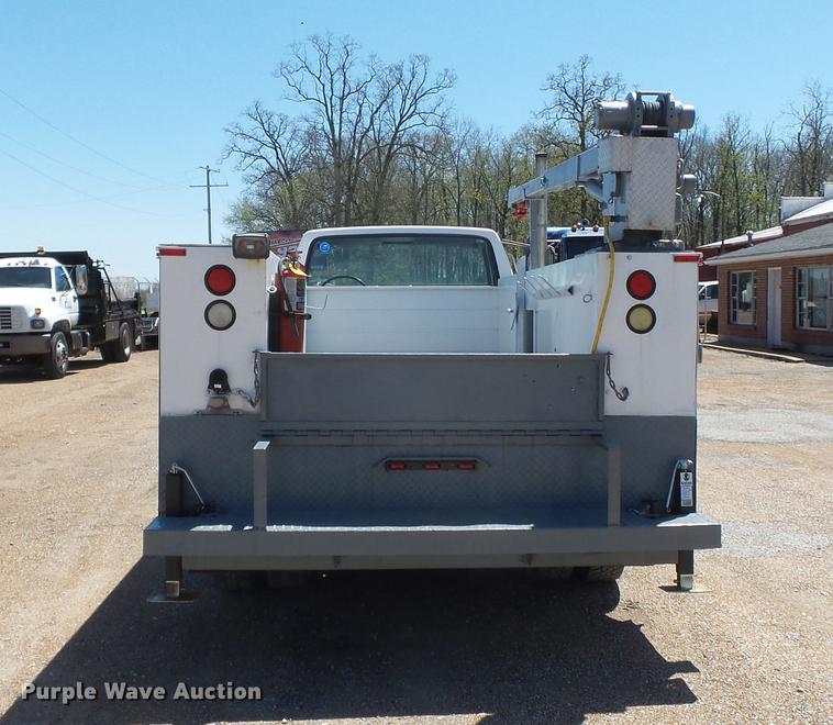 image for item DB7150 1995 Ford F800 utility bed truck with crane