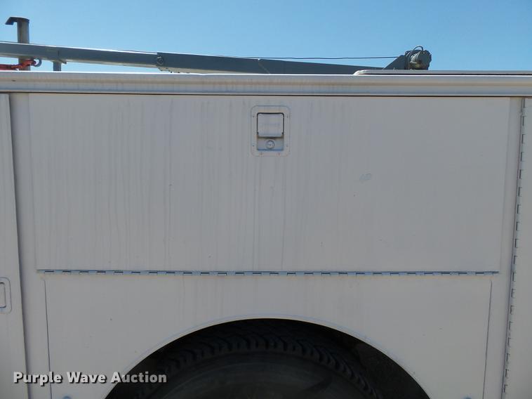 image for item DB7150 1995 Ford F800 utility bed truck with crane