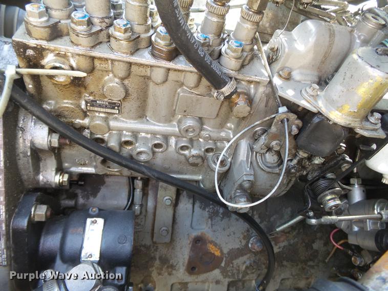 image for item DB7150 1995 Ford F800 utility bed truck with crane