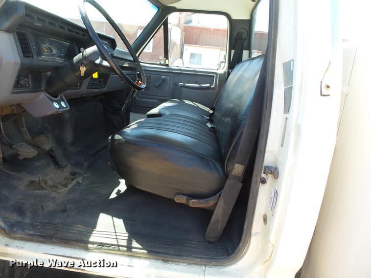 image for item DB7150 1995 Ford F800 utility bed truck with crane