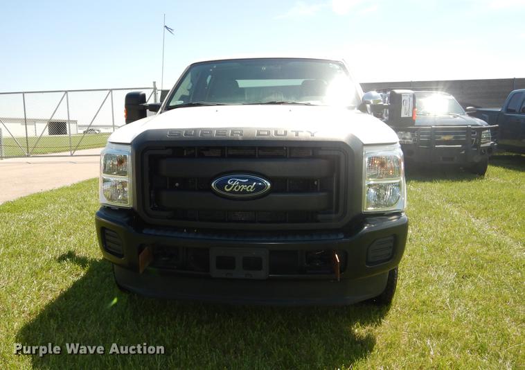 image for item DC0466 2012 Ford F250 Super Duty Crew Cab utility bed pickup truck