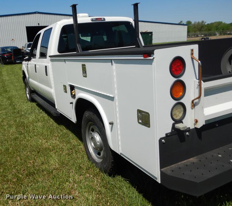 image for item DC0466 2012 Ford F250 Super Duty Crew Cab utility bed pickup truck