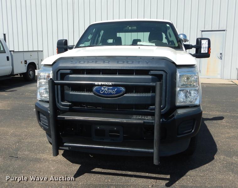 image for item DE1642 2014 Ford F250 Super Duty Crew Cab utility bed pickup truck