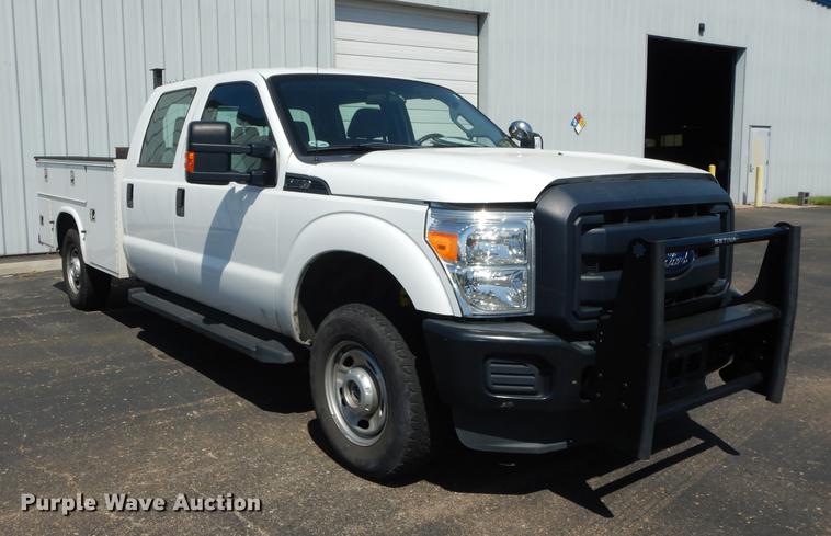 image for item DE1642 2014 Ford F250 Super Duty Crew Cab utility bed pickup truck