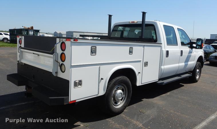 image for item DE1642 2014 Ford F250 Super Duty Crew Cab utility bed pickup truck