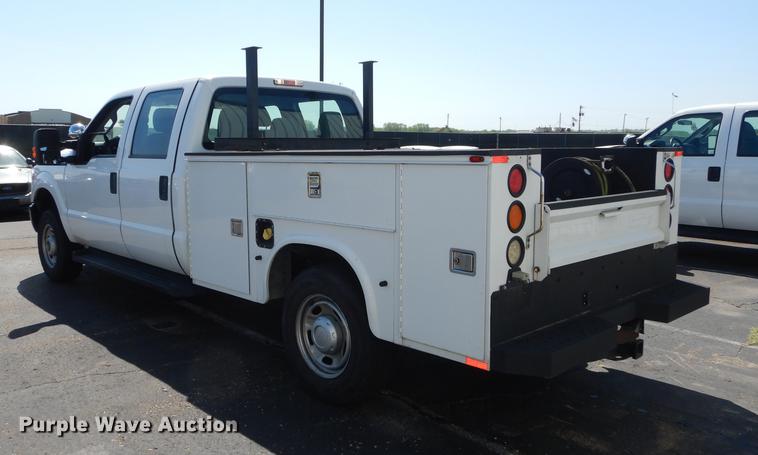 image for item DE1642 2014 Ford F250 Super Duty Crew Cab utility bed pickup truck