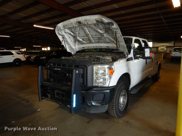 image for item DE1653 2012 Ford F250 Super Duty XL Crew Cab utility bed pickup truck