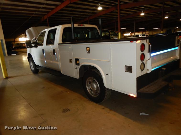 image for item DE1653 2012 Ford F250 Super Duty XL Crew Cab utility bed pickup truck