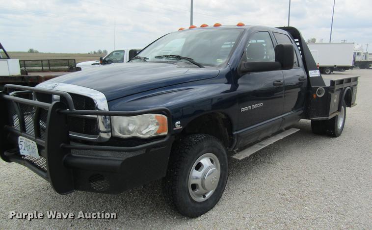 image for item DC4257 2004 Dodge Ram 3500 Quad Cab flatbed pickup truck