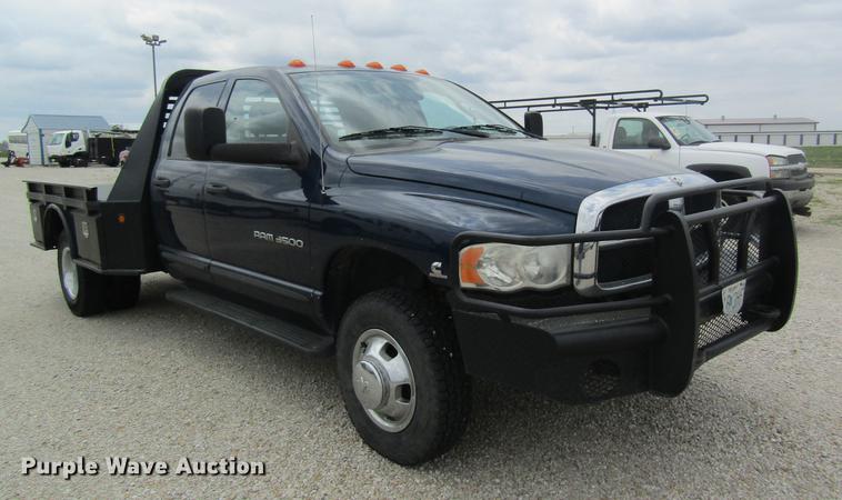 image for item DC4257 2004 Dodge Ram 3500 Quad Cab flatbed pickup truck